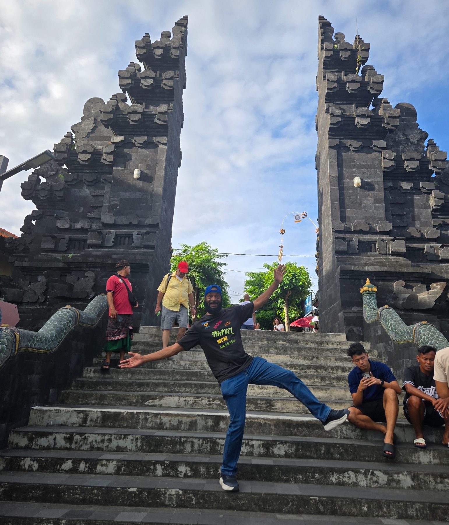 Darnell walking through a traditional Bali temple gate
