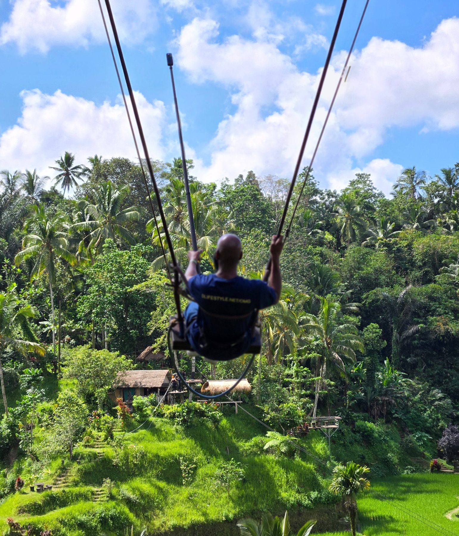 Darnell on a jungle swing above the Bali landscape