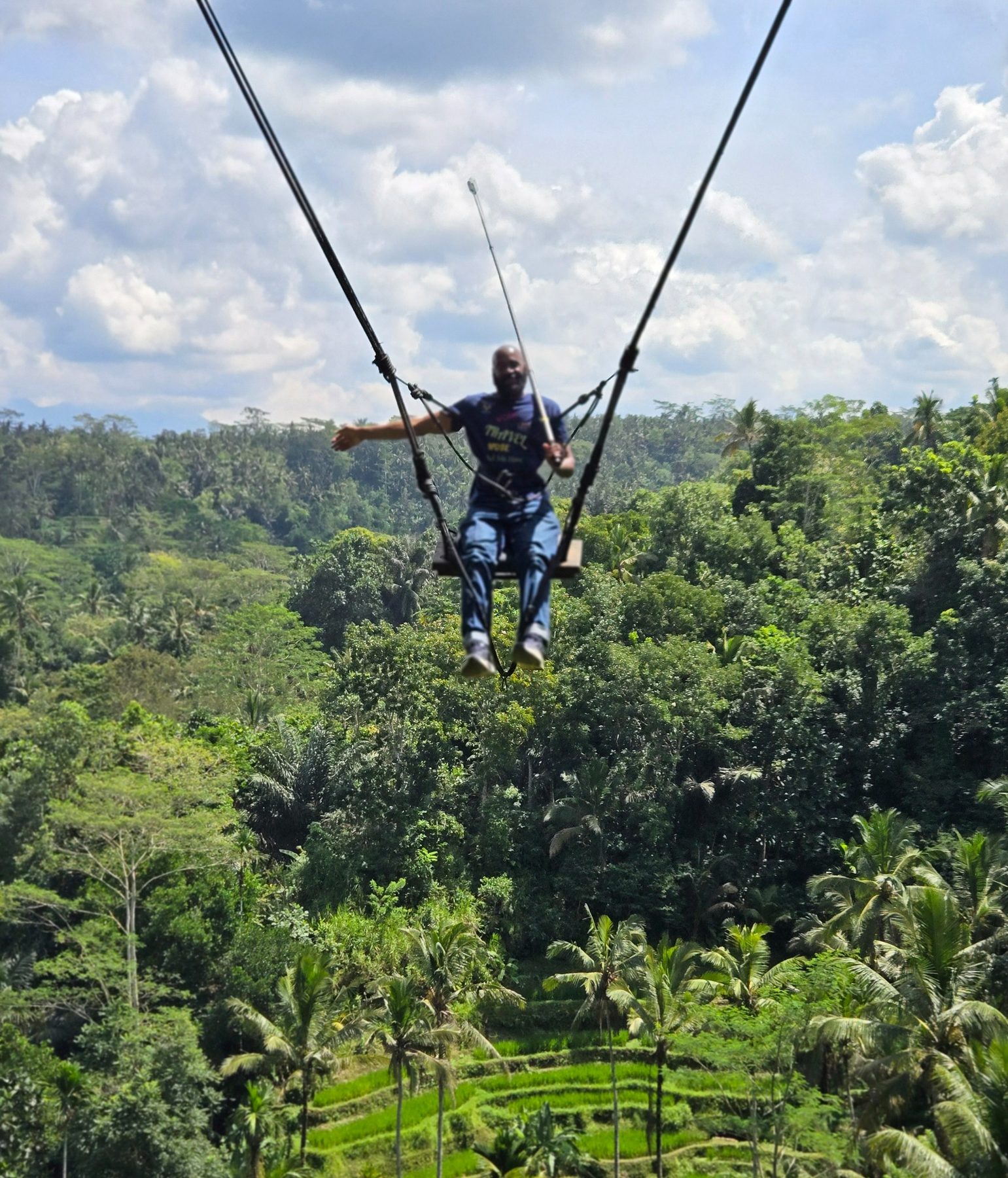 Darnell enjoying a high swing over the Bali jungle