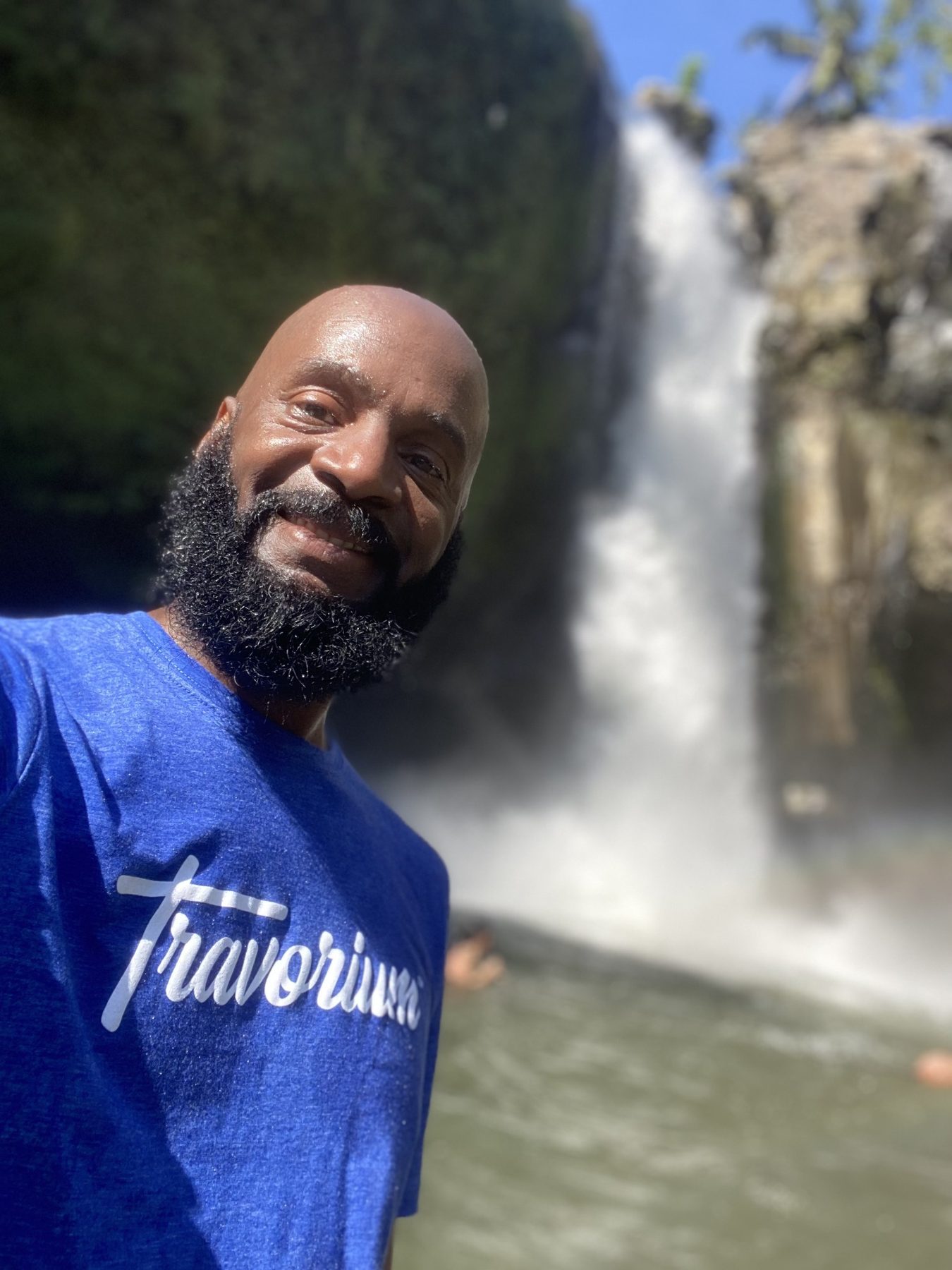 Darnell taking a selfie at the Bali waterfall