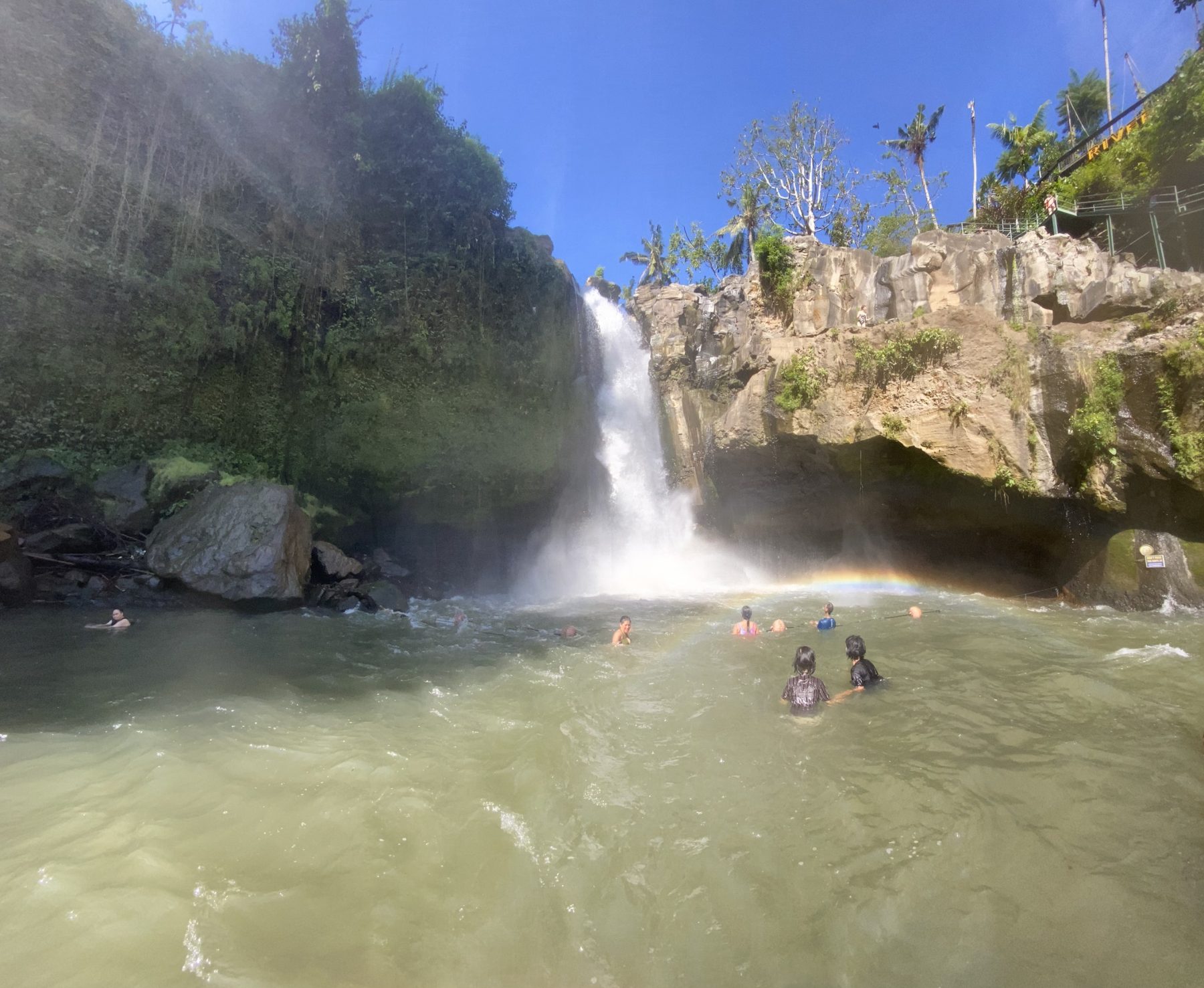 Wide view of a Bali waterfall and swimming pool