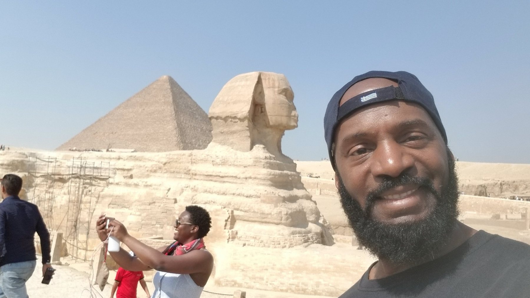 Darnell taking a selfie with the Great Sphinx and pyramid in Giza