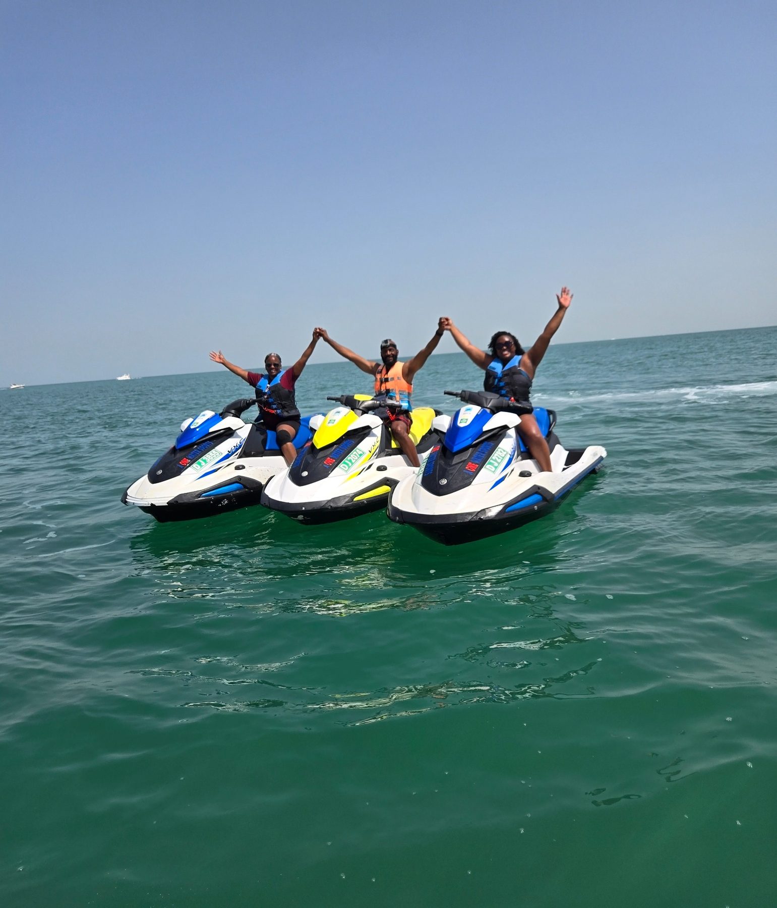 Friends on jet skis in Dubai