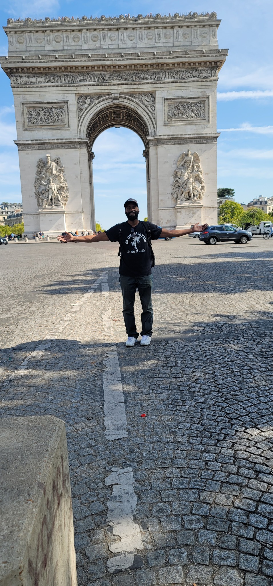 Darnell standing in front of the Arc de Triomphe in Paris