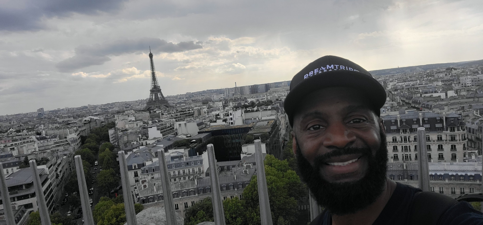 Darnell overlooking Paris with the Eiffel Tower behind him