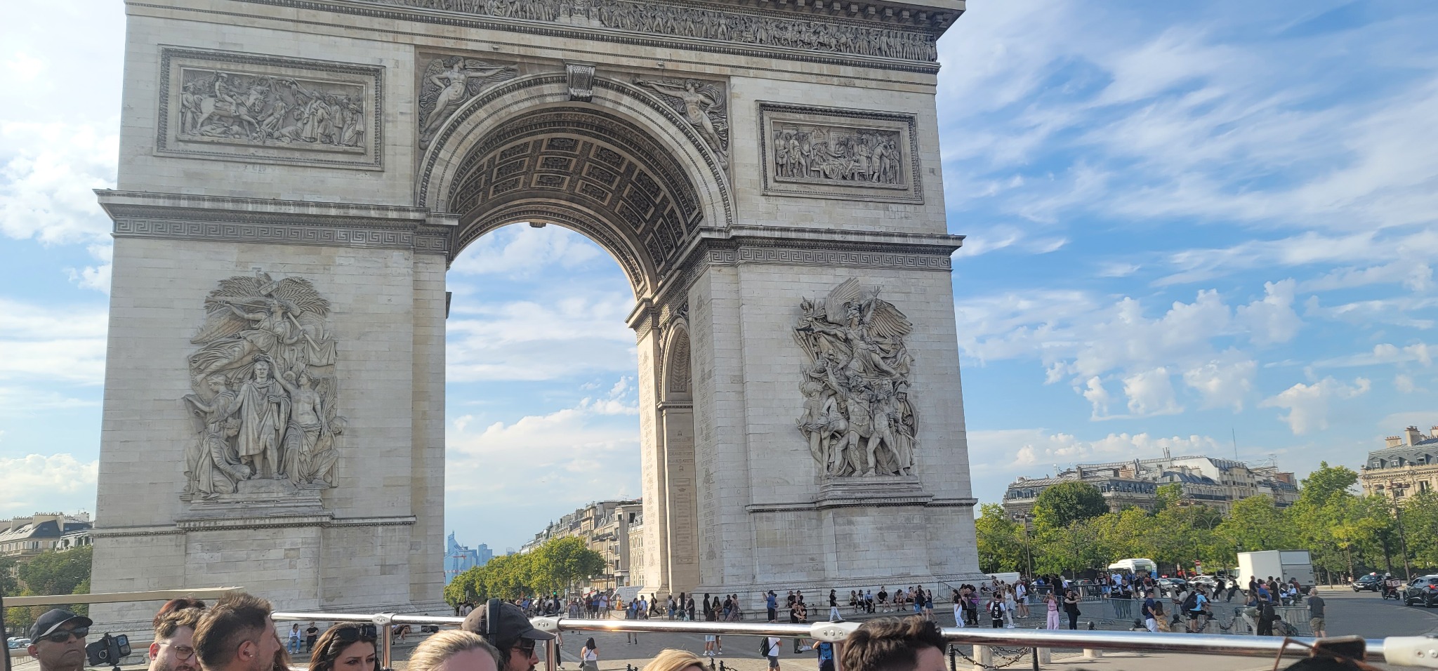 Traveler posing beneath the Eiffel Tower