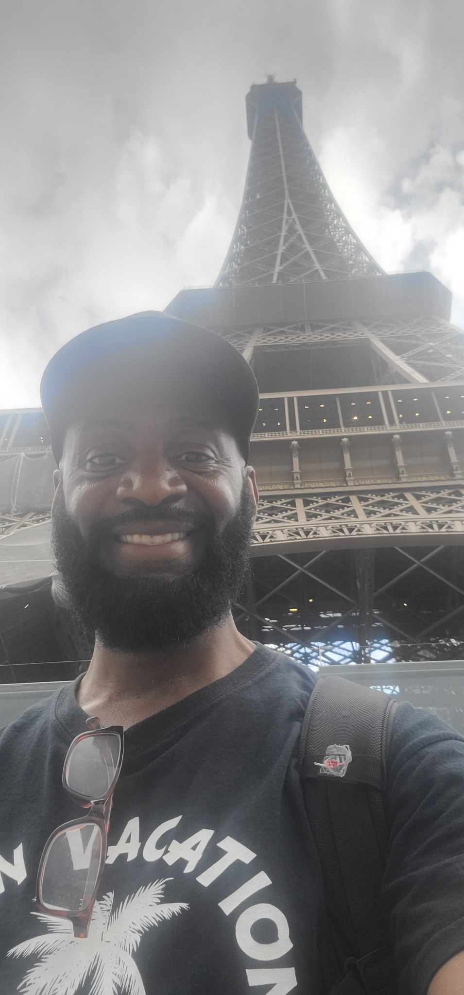 Darnell taking a selfie beneath the Eiffel Tower