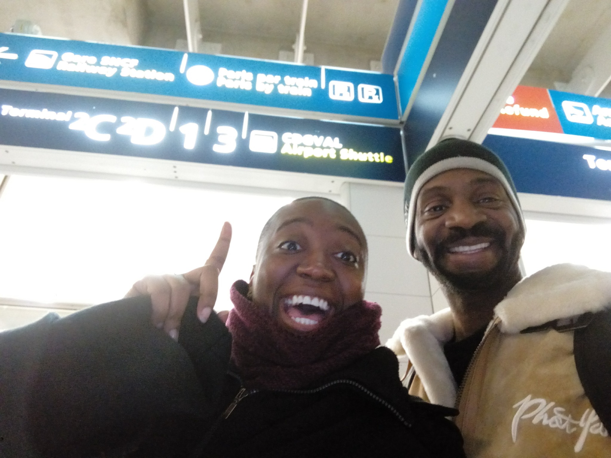 Darnell and a travel companion at a Paris airport on an earlier trip