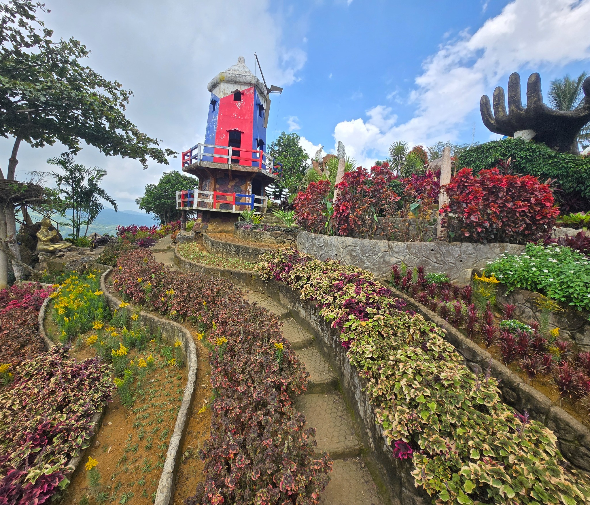 Darnell at the central Sirao Garden signage